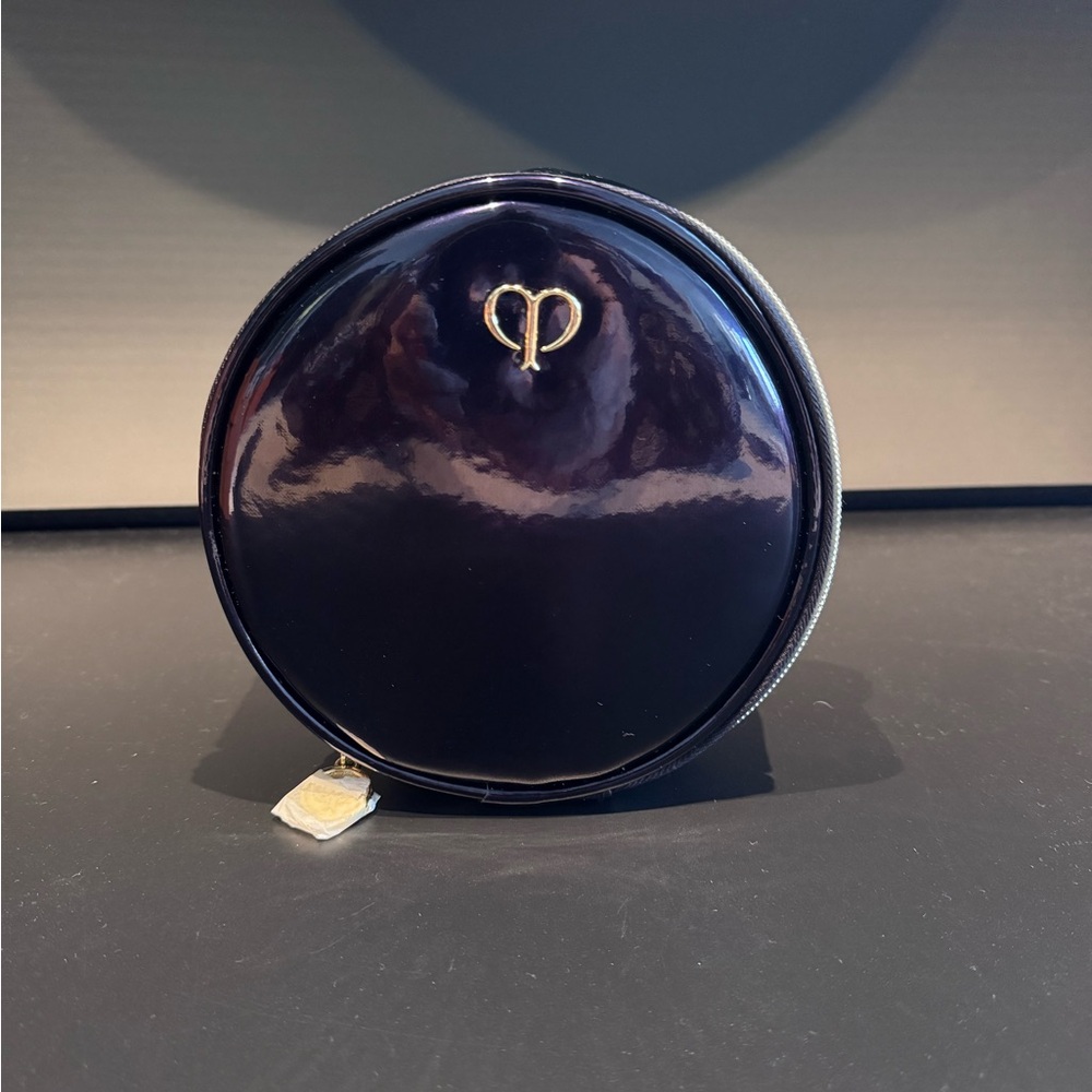 Brand NEW Cle de Peau Round Cosmetic Pouch